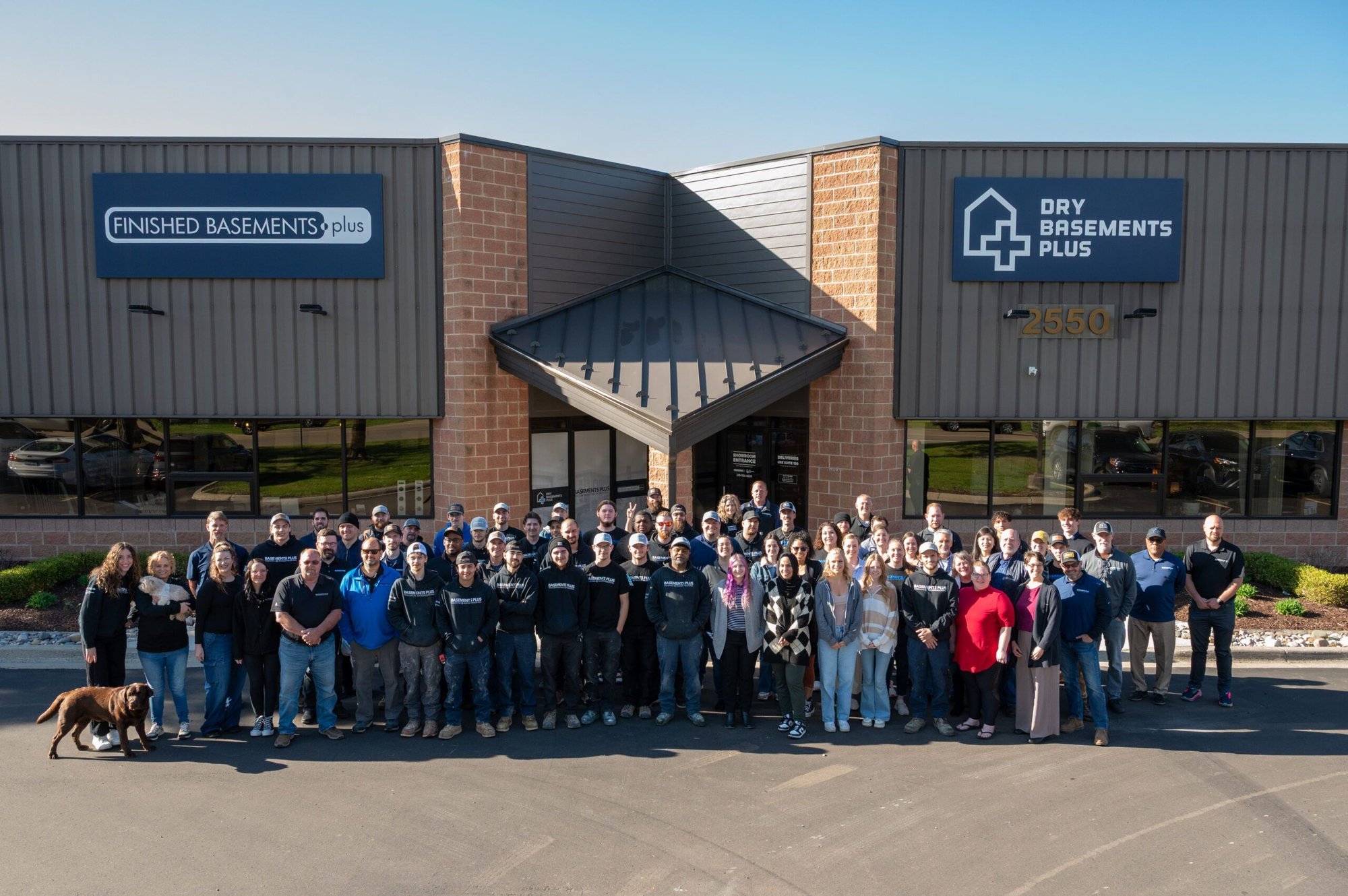 Basements Plus team photo in front of the office