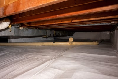 After shot of a crawl space encapsulation that included vapor seal, drainage mat and SilverGlo insulation