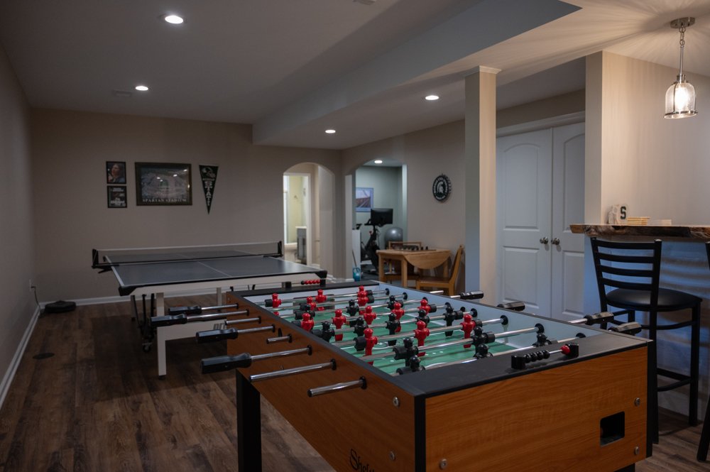Finished Basement with Seated Bar, Home Gym and Bathroom in Rochester, MI