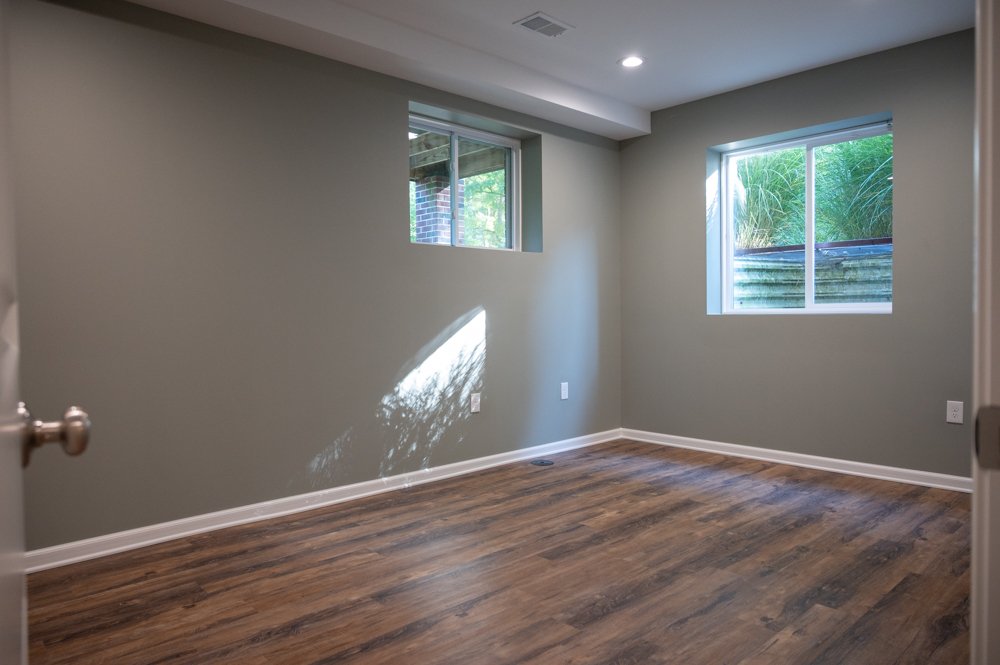 Finished Basement with Seated Bar, Home Gym and Bathroom in Rochester, MI