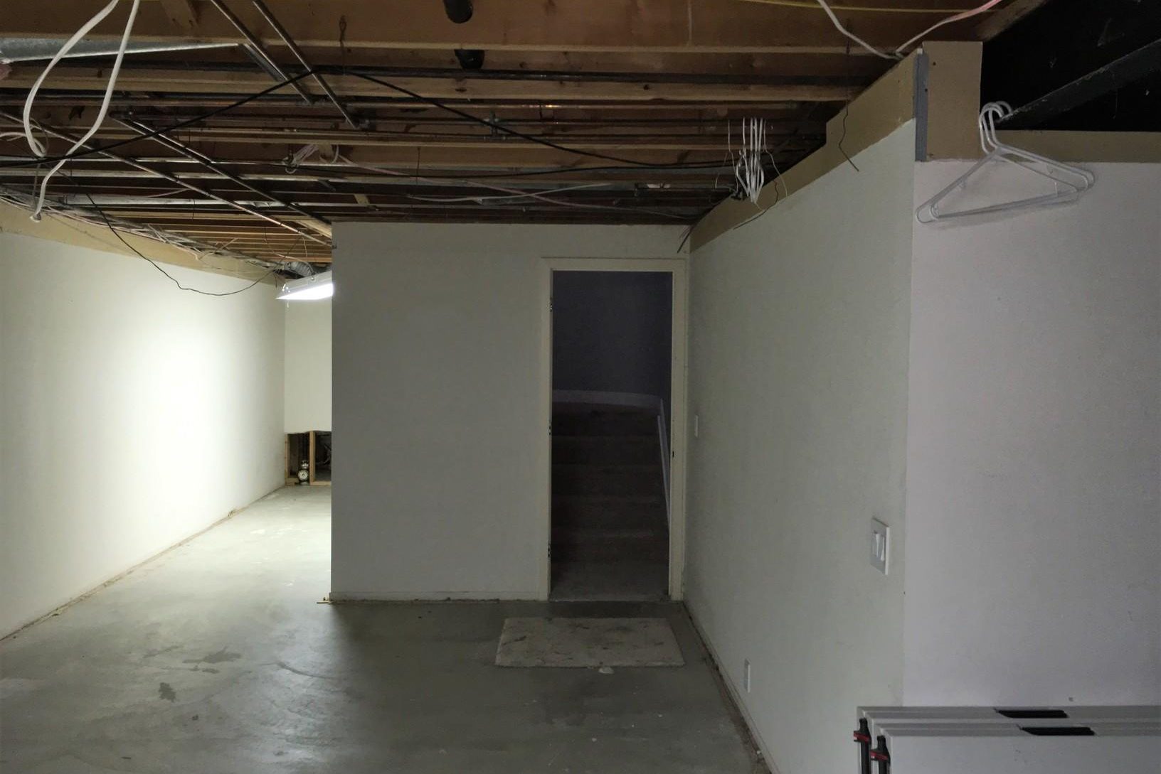 basement finishing project with closed off bad layout