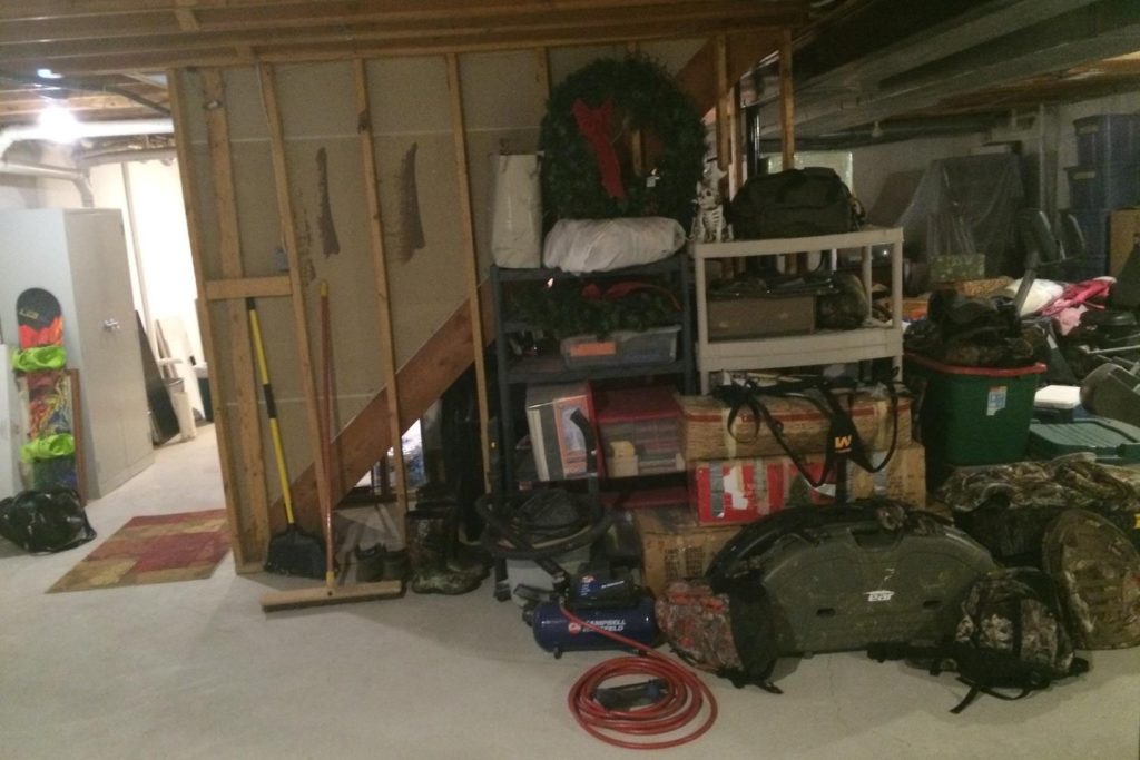 storage in unfinished basement next to staircase