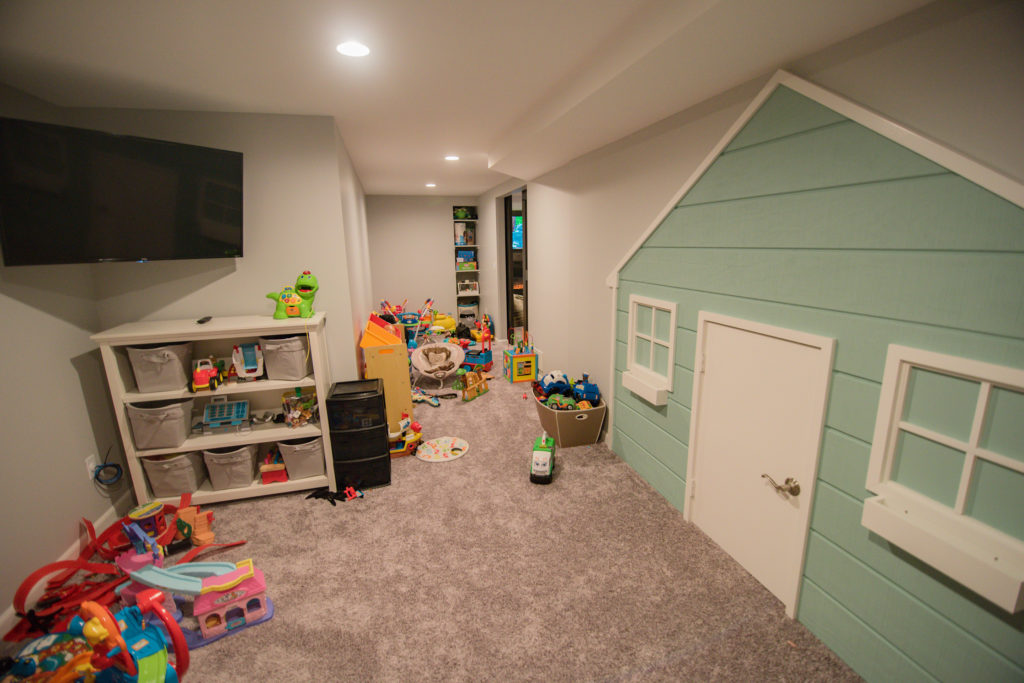 finished basement playroom for kids with built in doll house
