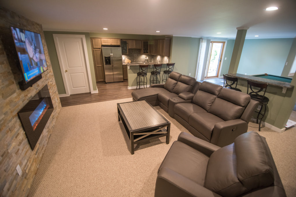 walkout basement with comfortable carpet and vinyl plank flooring