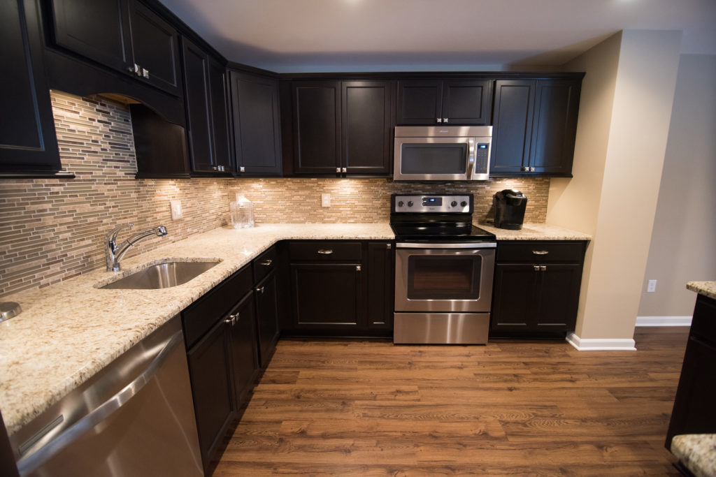 novi michigan finished basement with vinyl plank and kitchen with granite