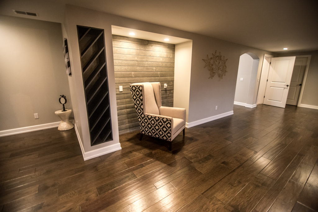 shiplap niche for basement office with dark wood flooring