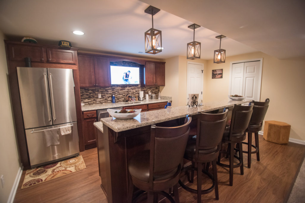 traditional basement design with carpet tori maple cabinets and granite countertops