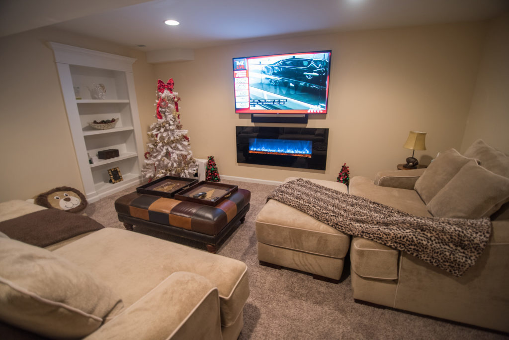 baseent living room with secret bookcase door