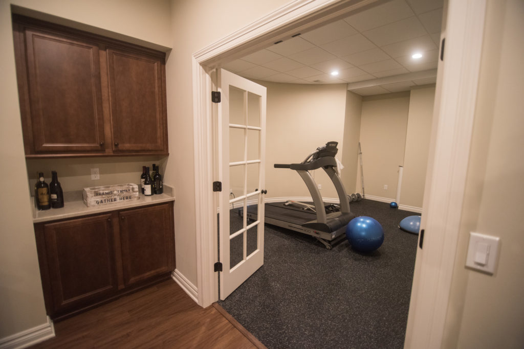 basement exercise area with french doors