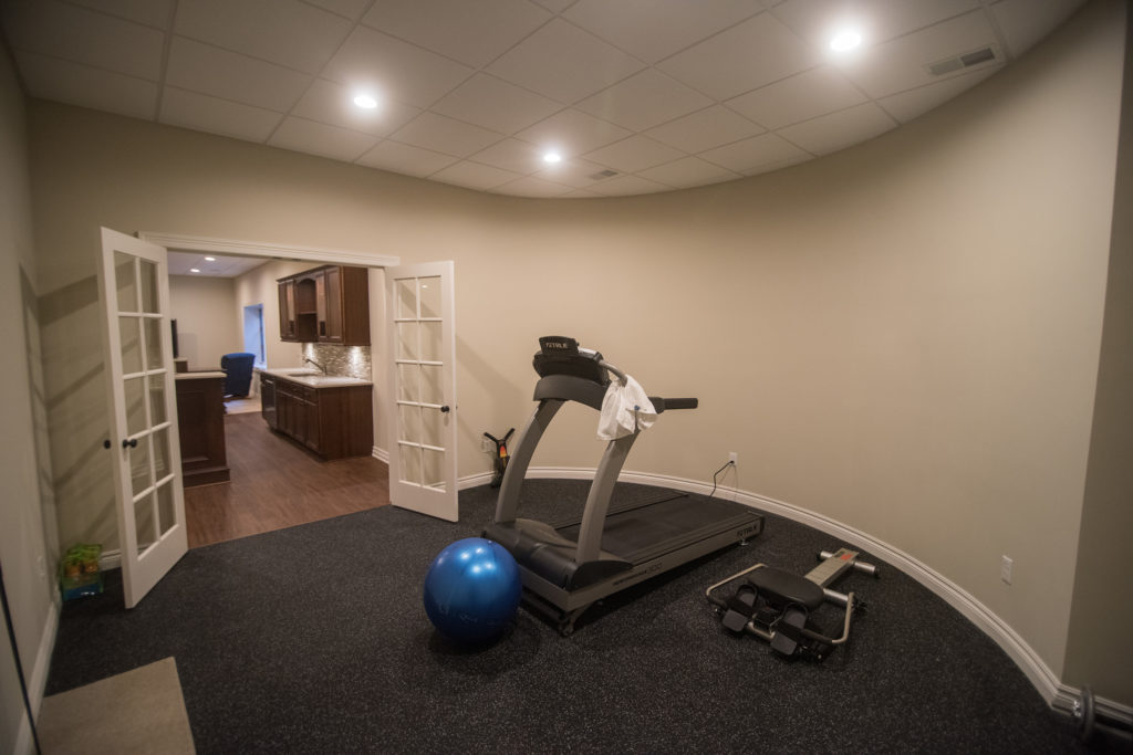 basement exercise room with french doors