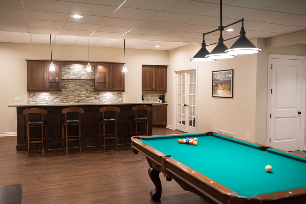 pool table in basement with classic finishes
