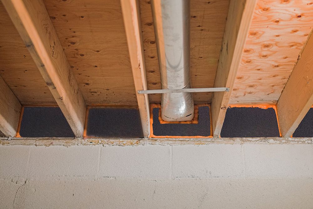 bond insulation in ceiling joists in basement