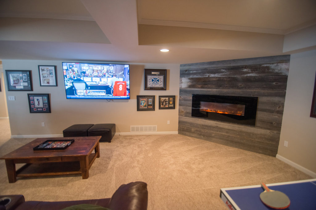 reclaimed wood planks on electric fireplace surround