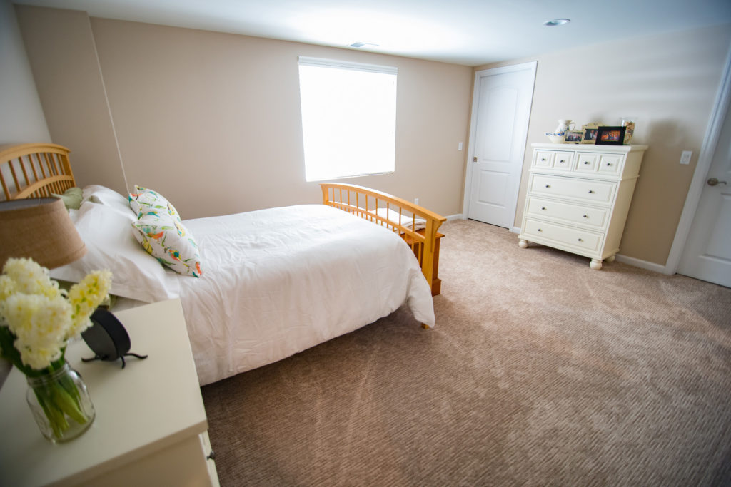 large basement bedroom with egress window and plenty of natural light