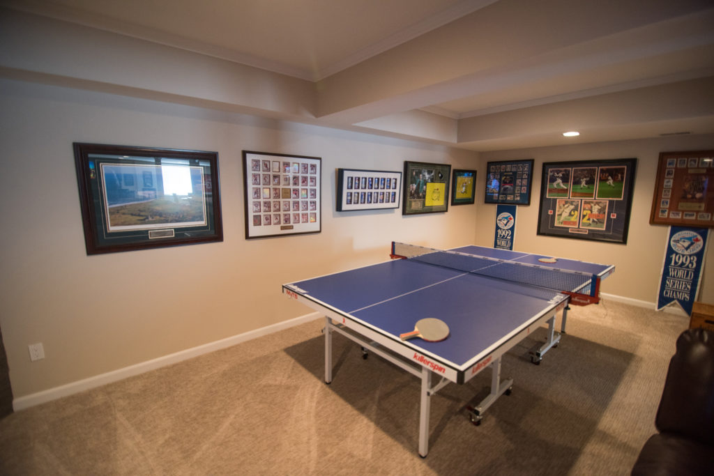 ping pong area with awards and sports memorabilia