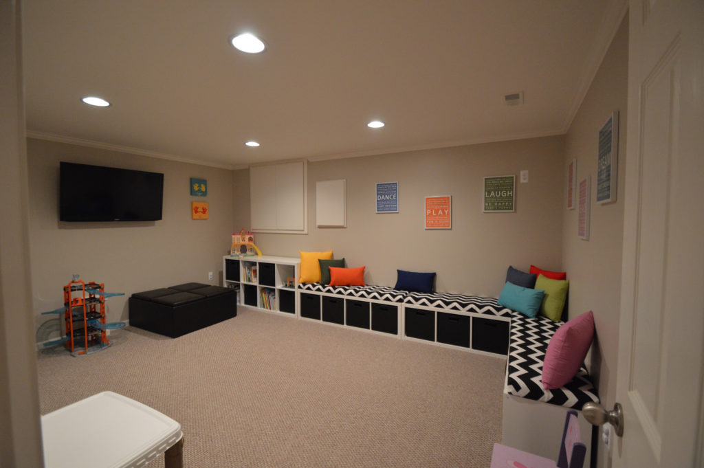 basement playroom for the kids with carpet