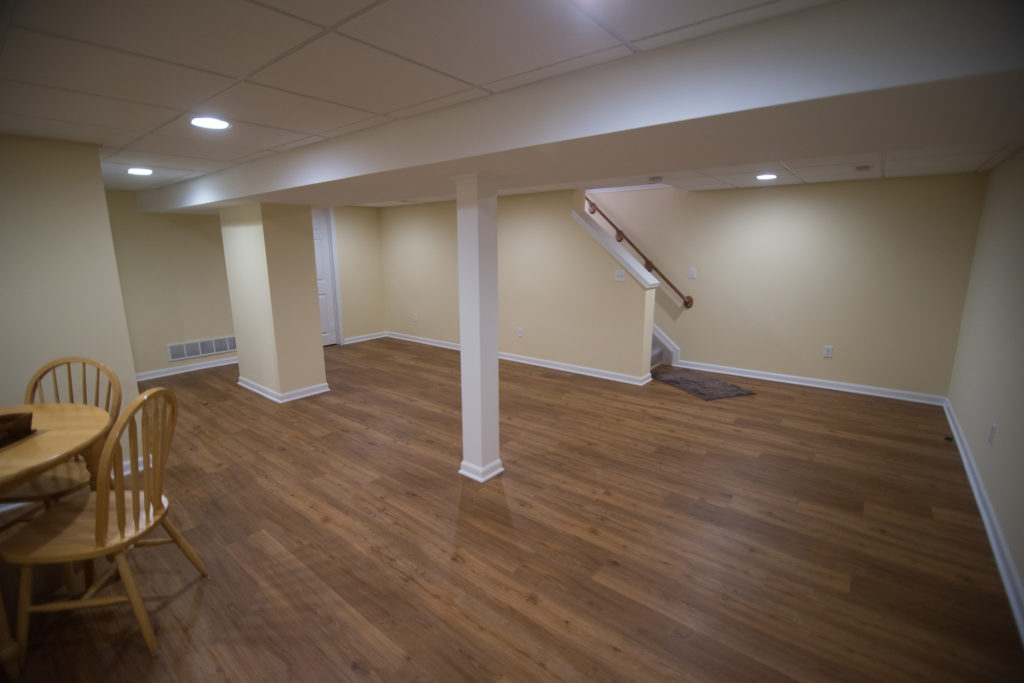 remodeled basement clean for entertaining with bright design