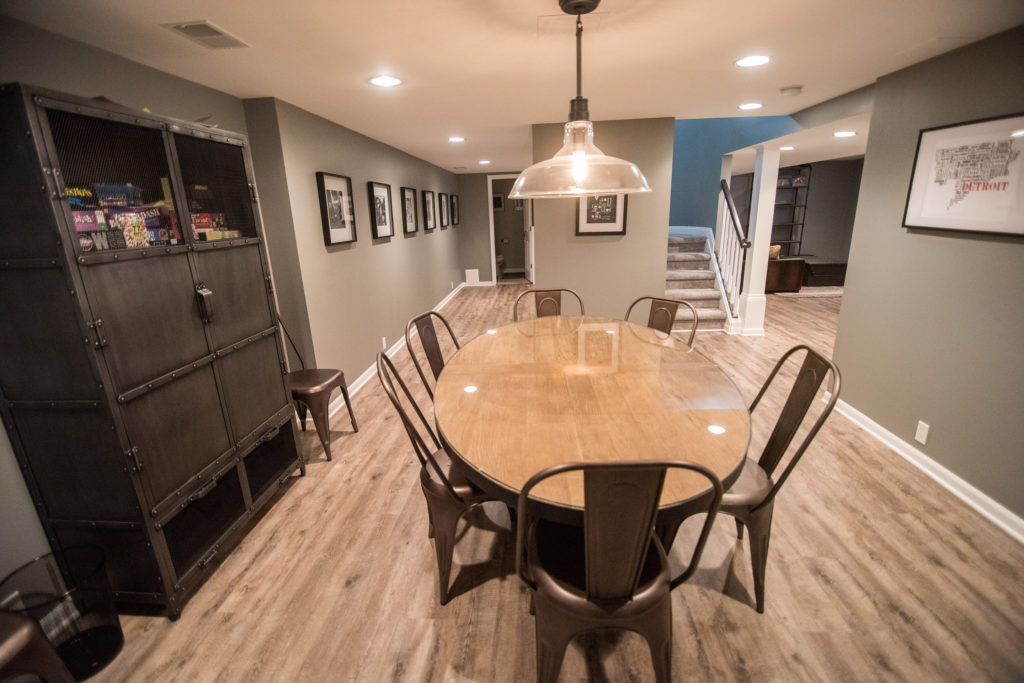 basement dining room with table and ceiling light