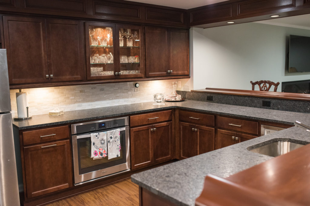 basement kitchen with pub style wood working and posts