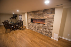 Electric fireplace within wall as design feature in Northville, Michigan