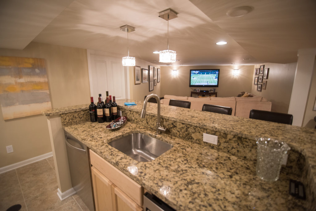 finished basement kitchen with granite countertops