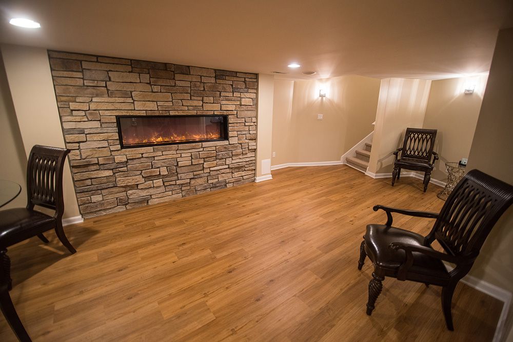 large stone fireplace on basement wall in Michigan