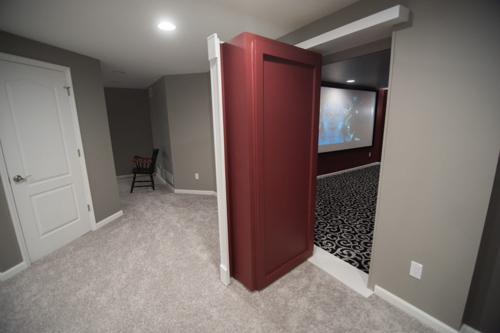 secret door leading into basement theater