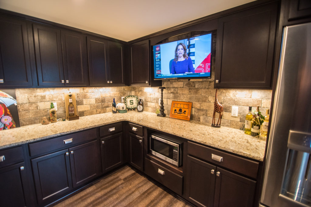 custom bar in finished basement novi dark vinyl plank granite countertops
