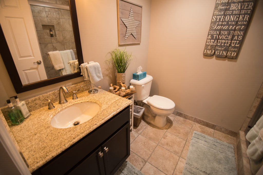 vinyl tile in basement bathroom with vanity