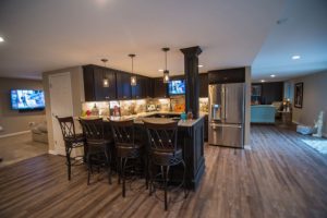 Finished basement with bar and vinyl plank flooring in Novi, Michigan