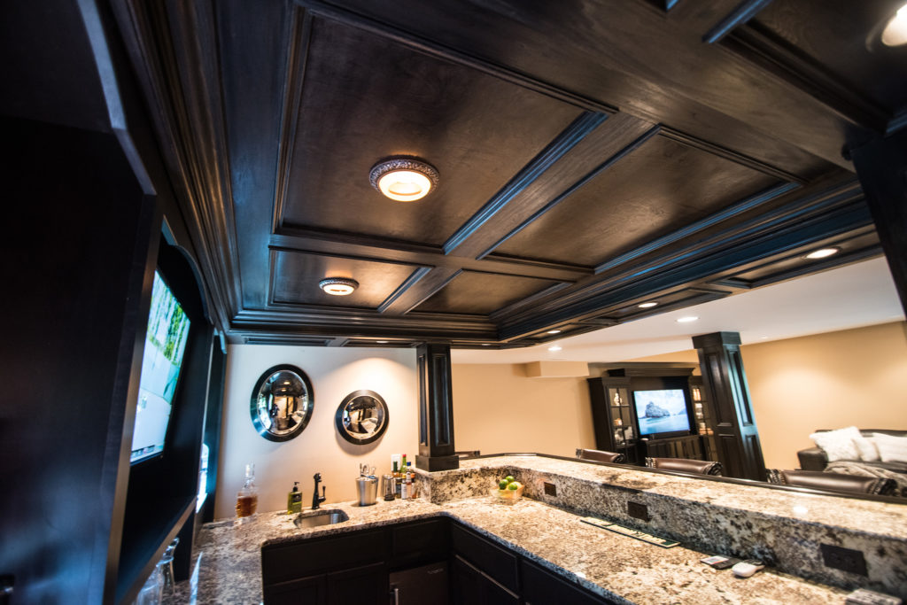 wood paneled ceiling in bar finishes off the design