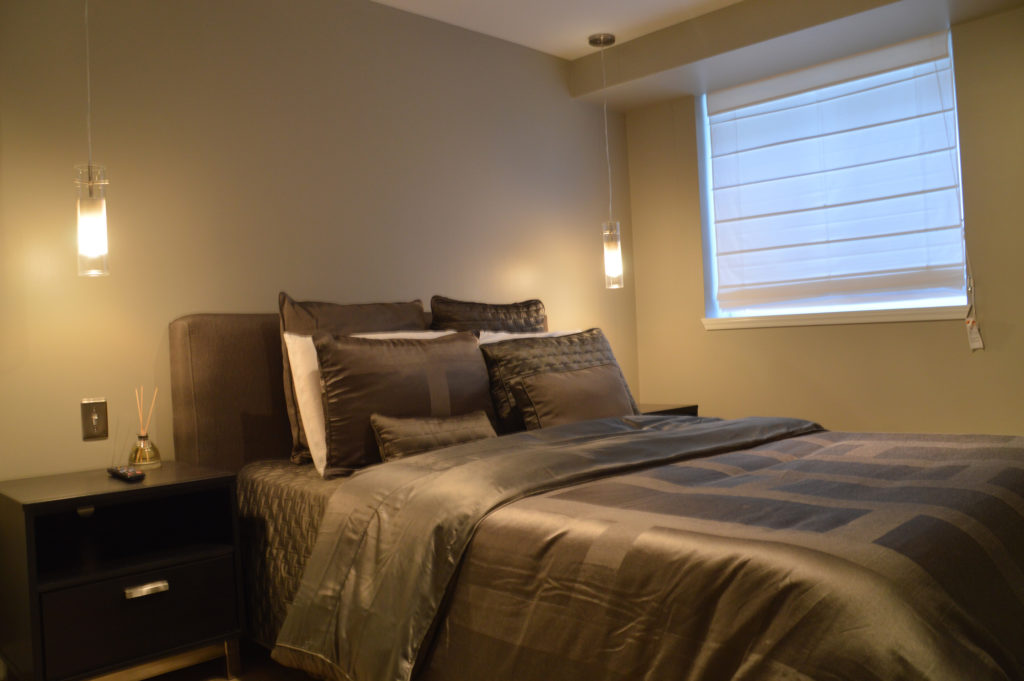 calm basement bedroom with egress window