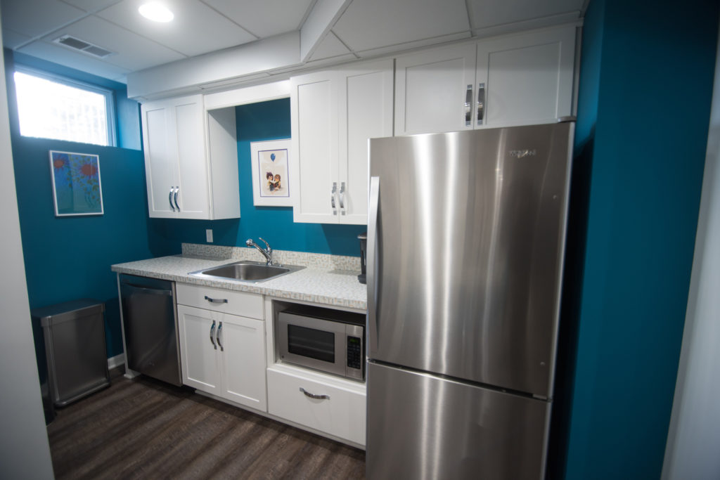 basement kitchen with shaker style cabinets