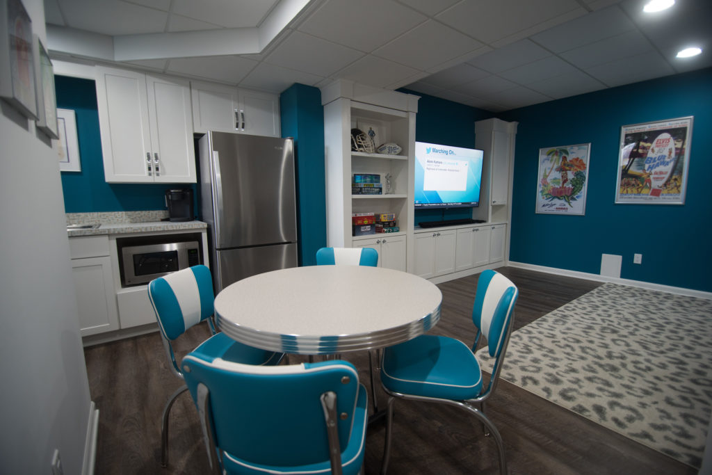 retro basement dinner table with blue accents