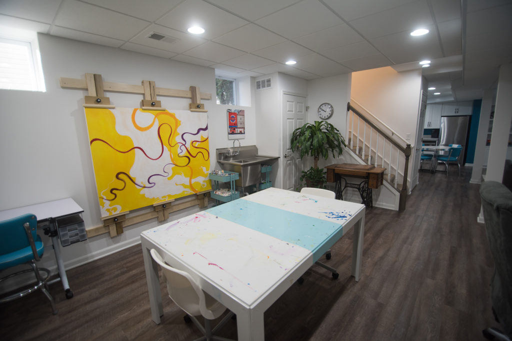 custom built basement art studio with washing sink