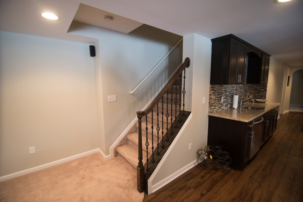 open rail staircase in basement