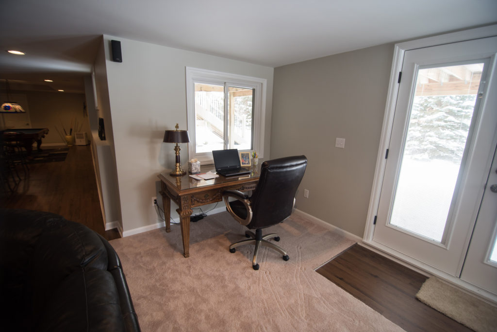 small home office area in living room of basement