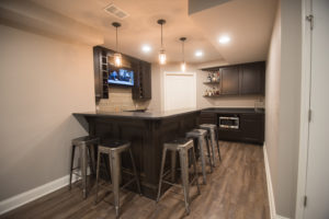 industrial rustic basement bar with metal stools