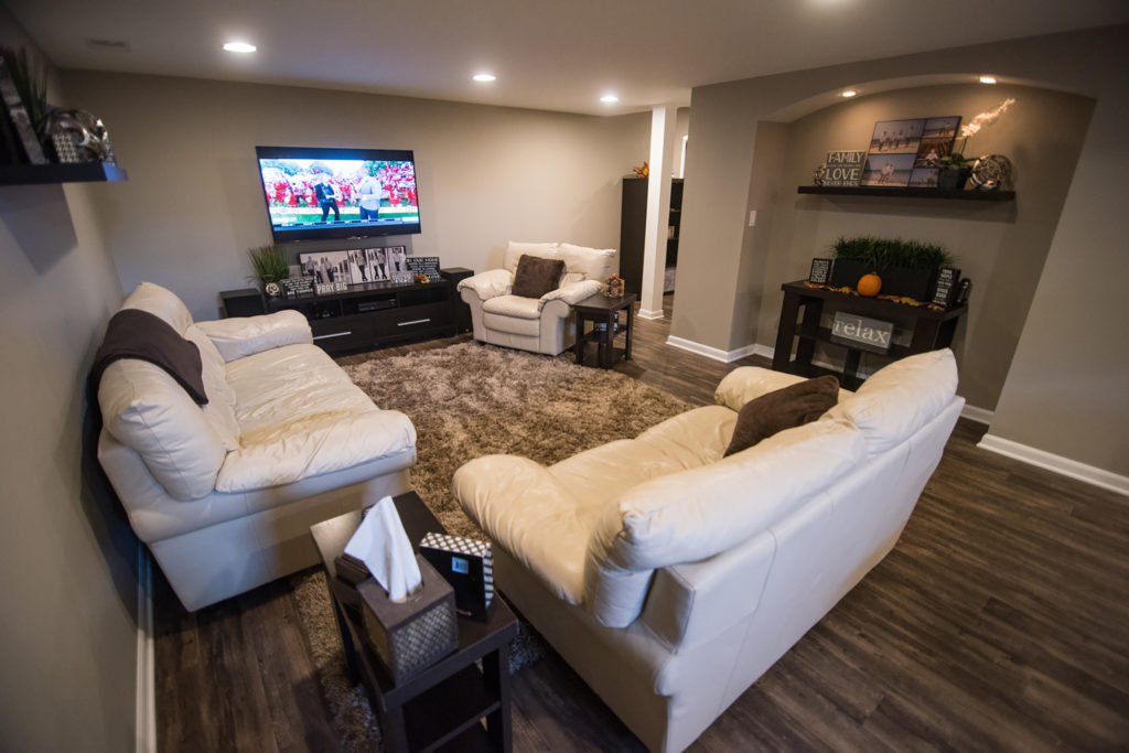 lower level living room with vinyl plank flooring