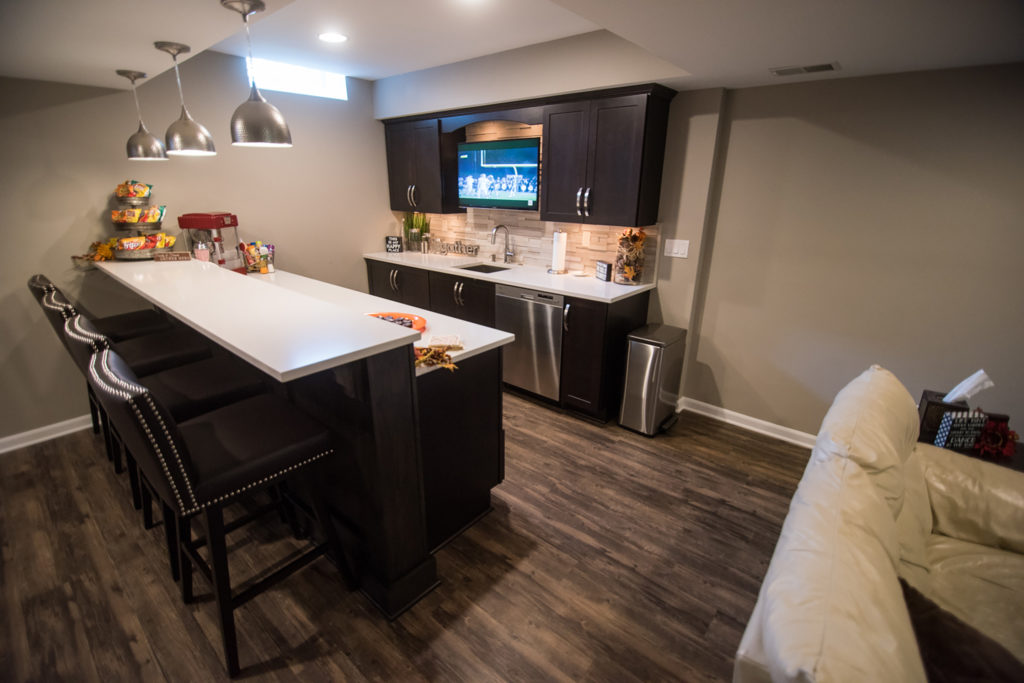 basement bar with quartz countertop