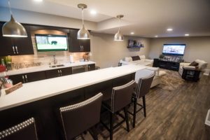 basement bar connecting to living room for open concept feel