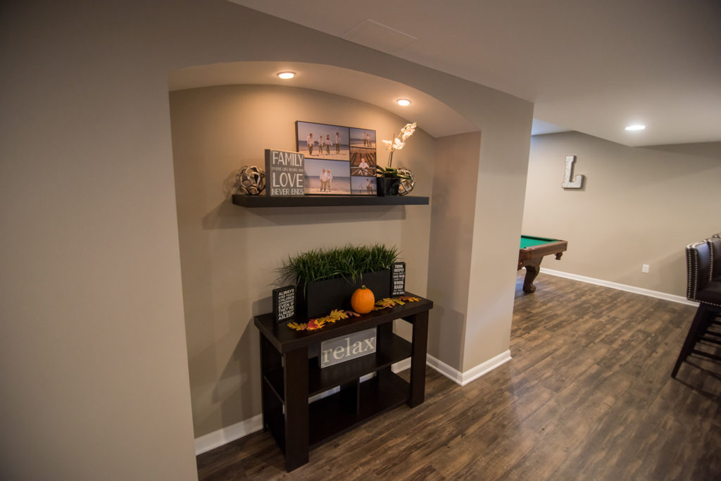 arched cutout in basement wall for added design features