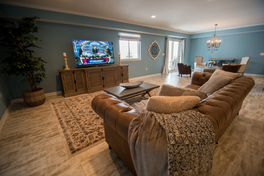 South Lyon Michigan open concept basement living room with rustic beach theme