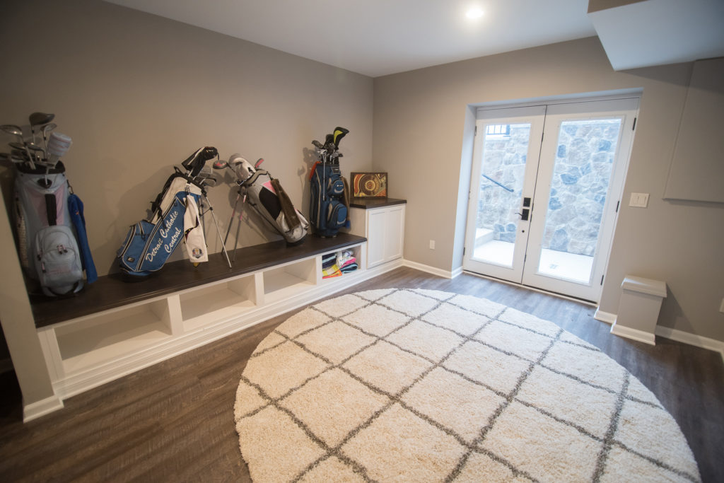custom shelf bench leading to walk out basement door