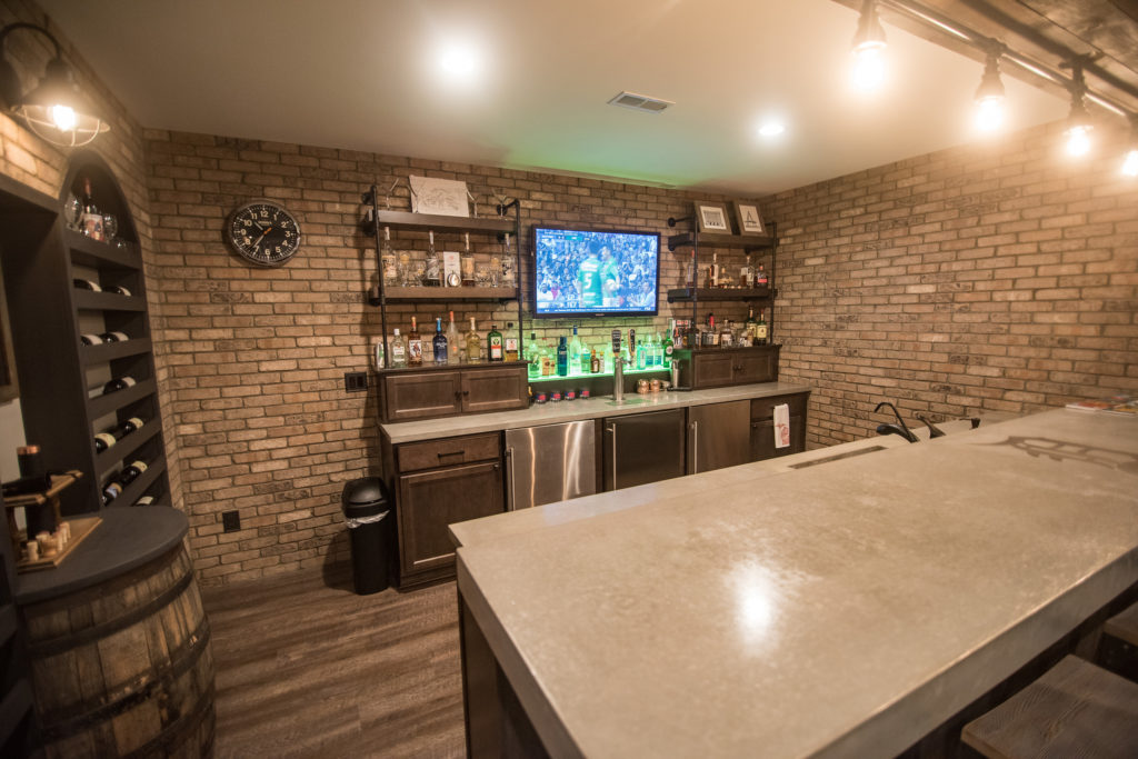 Brick walled bar with concrete countertops