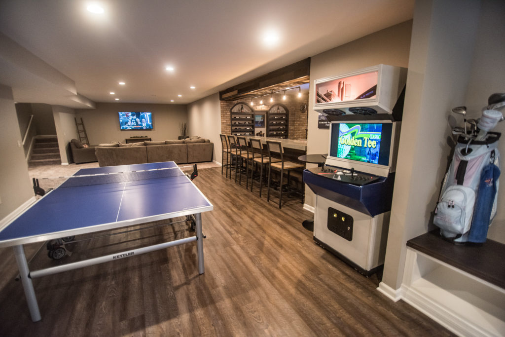 finished basement with arcade game and ping pong