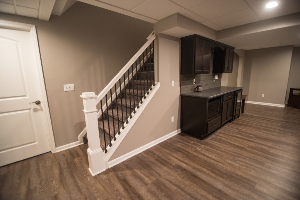 detailed staircase spindles with white railing in basement