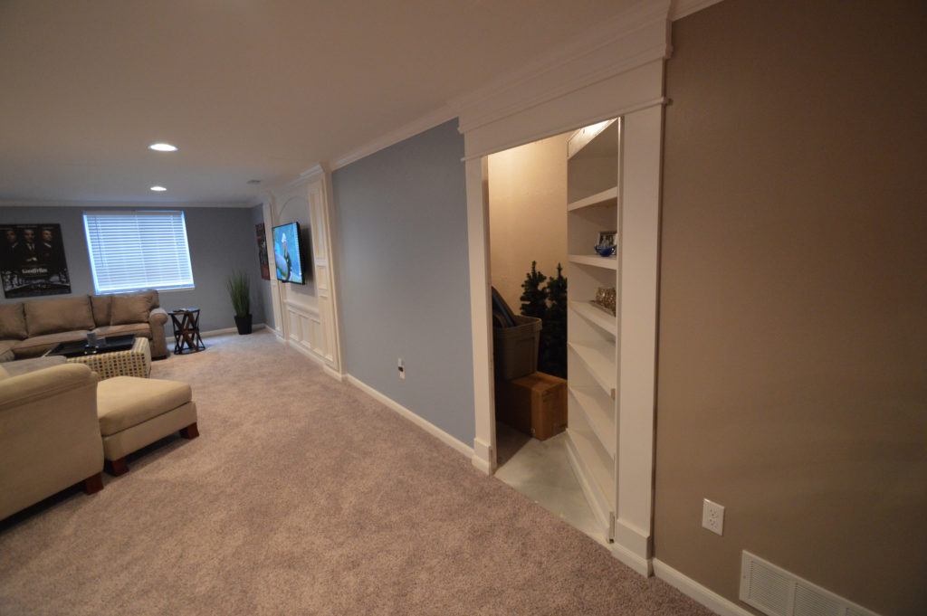 secret bookshelf door in basement
