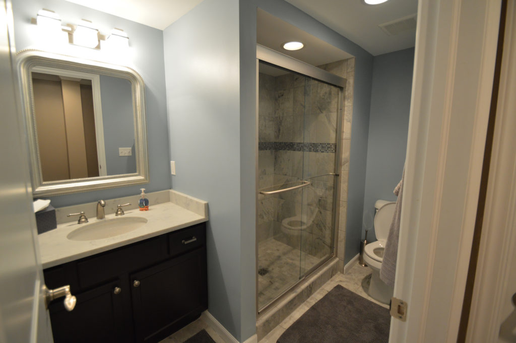 bright finished bathroom with vinyl tile