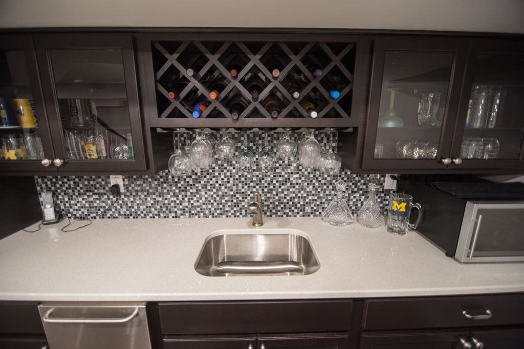 wine storage above sink in basement bar